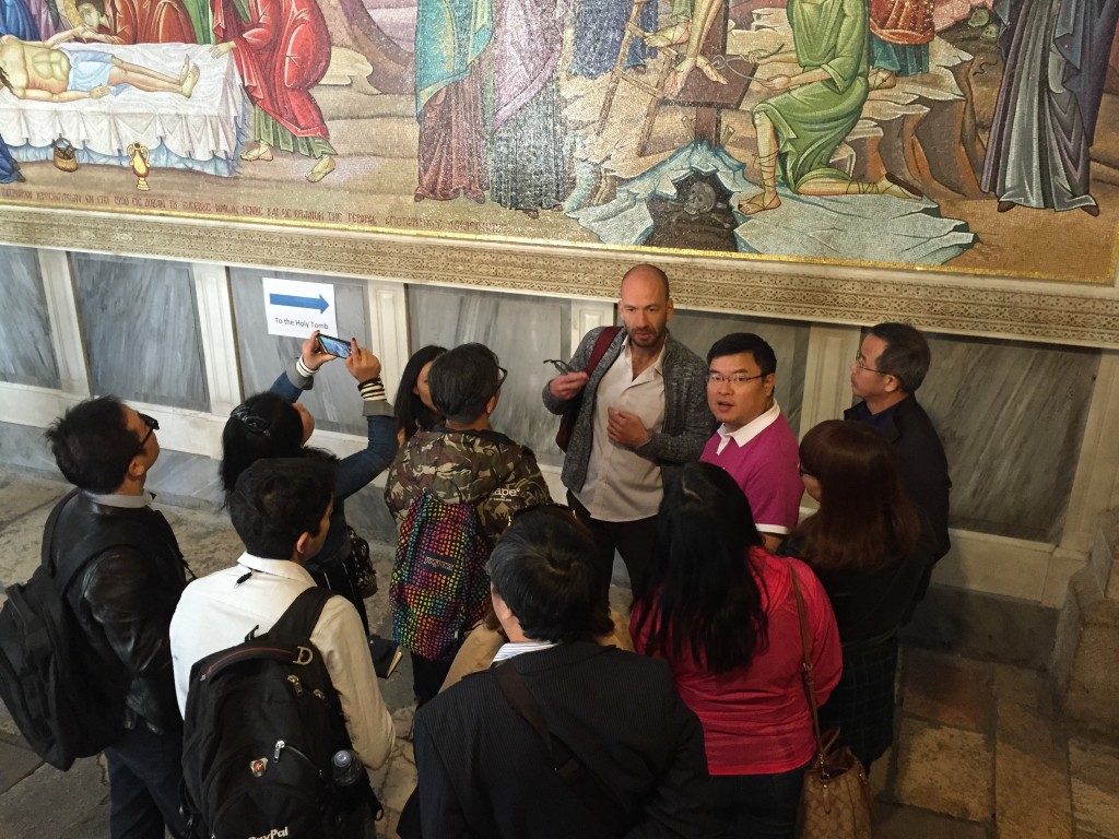 A Chinese tour group at the Church of the Holy Sepulchre in Jerusalem. Photo: Sara Toth Stub / The Tower