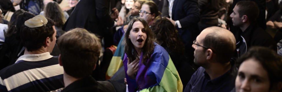 LGBT rights activists protested during a speech by Israeli Minister of Economics and Jewish Home party leader Naftali Bennett at a conference in Tel Aviv, February 24, 2015. Photo: Tomer Neuberg / Flash90